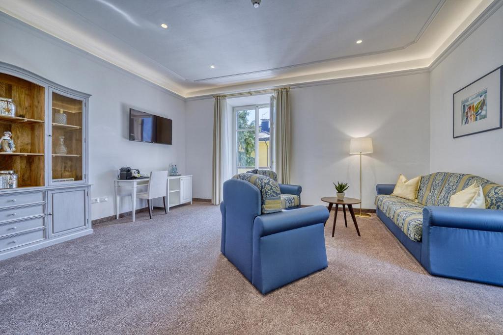 TV a/nebo společenská místnost v ubytování Villa Tell rooms and suites