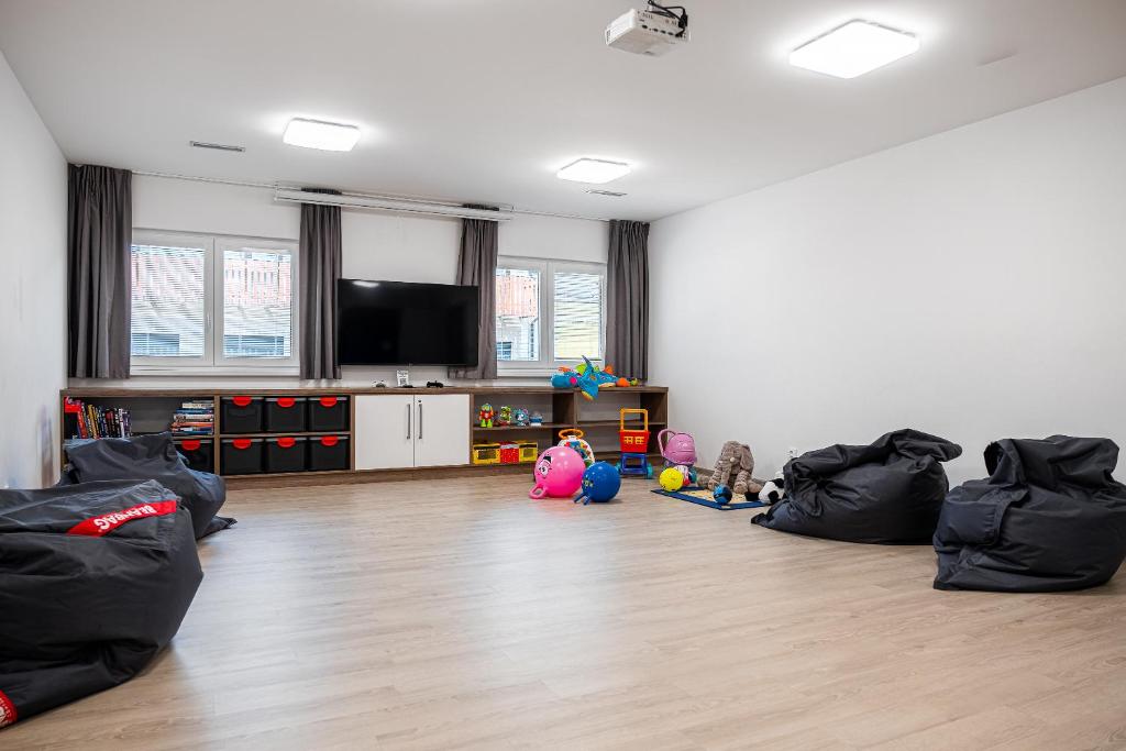 TV a/nebo společenská místnost v ubytování Apartmány ZaBukem