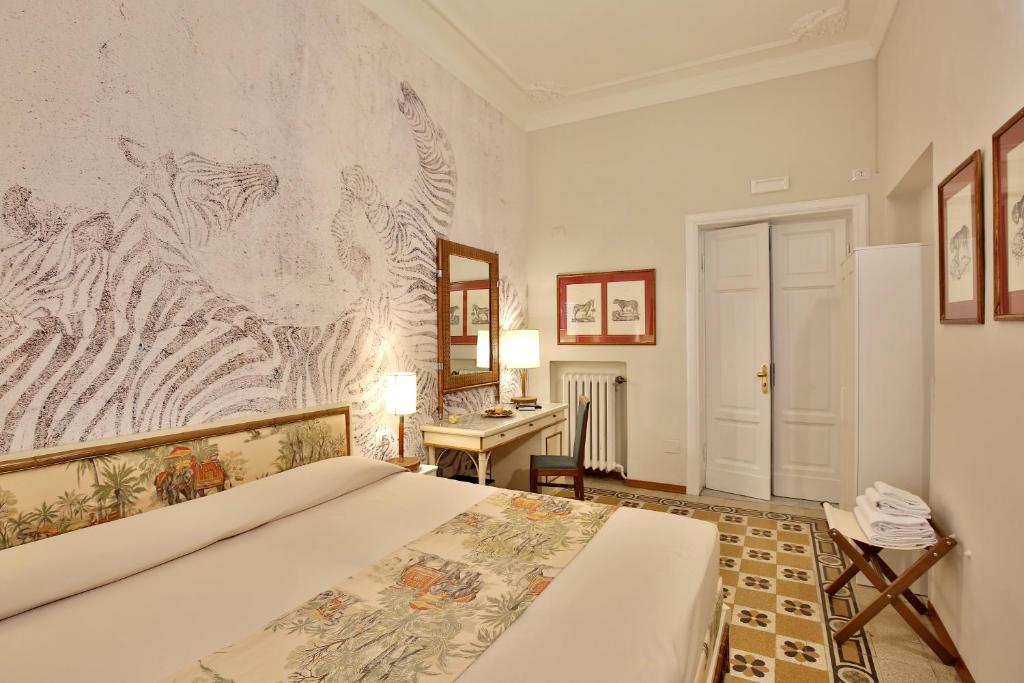 Posteľ alebo postele v izbe v ubytovaní MADAMA GUEST HOUSE