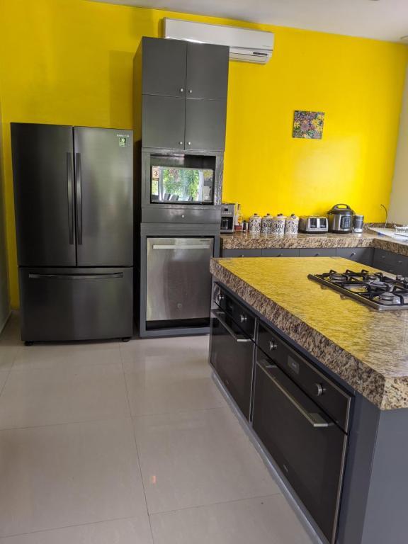 Kuchyň nebo kuchyňský kout v ubytování Casa Xcanatun