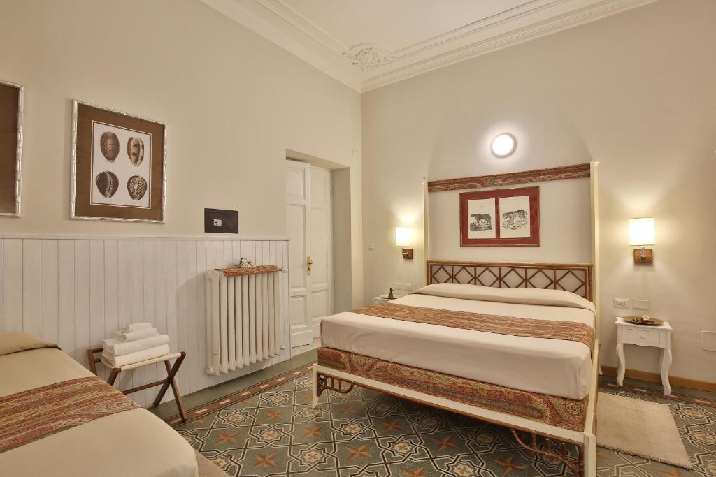 Posteľ alebo postele v izbe v ubytovaní MADAMA GUEST HOUSE