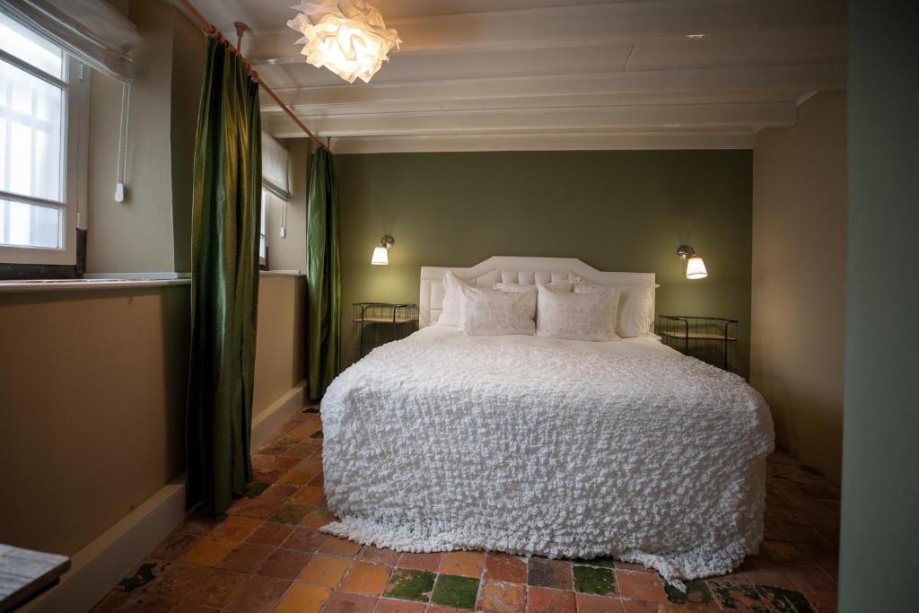 Postel nebo postele na pokoji v ubytování City House Grande Madame Agaath