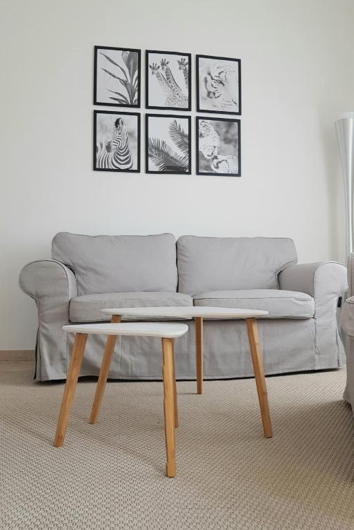 a living room with a couch and a coffee table at La Terrazza Apartment,a 50 mt dal mare in Varazze