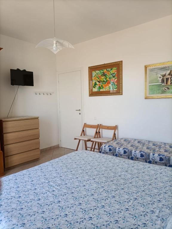 A bed or beds in a room at Il Respiro del Mare