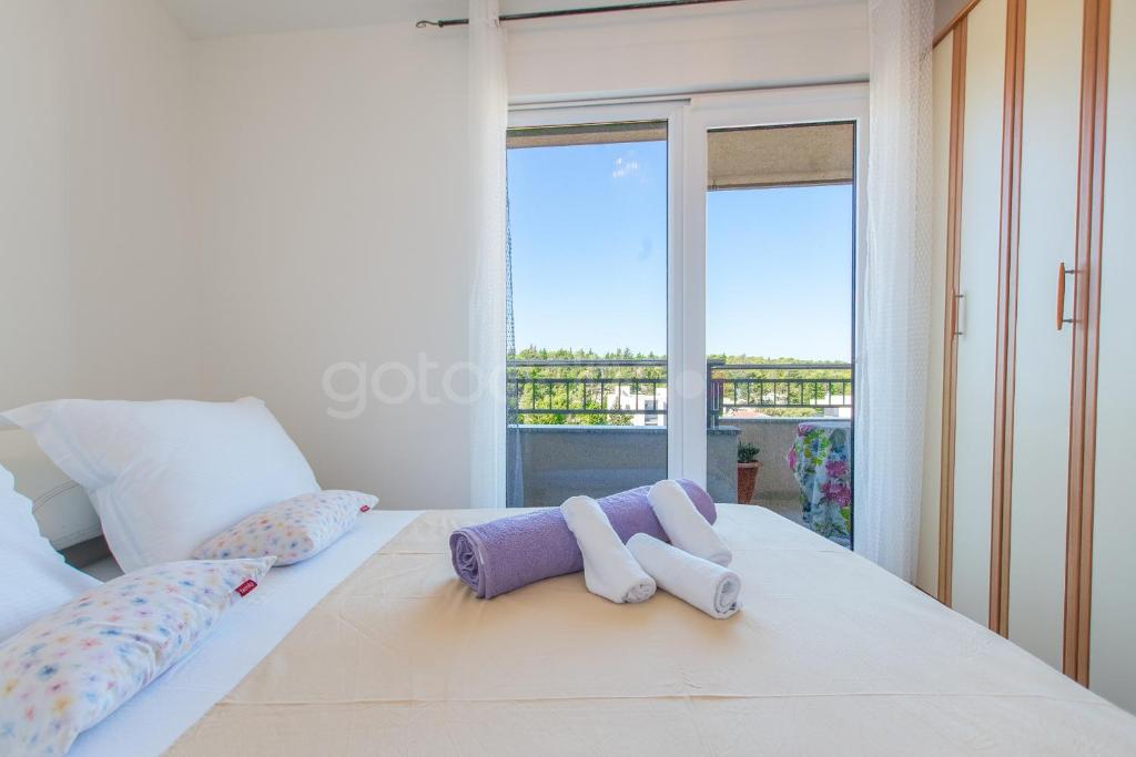 Posteľ alebo postele v izbe v ubytovaní Seaview apartments Duky