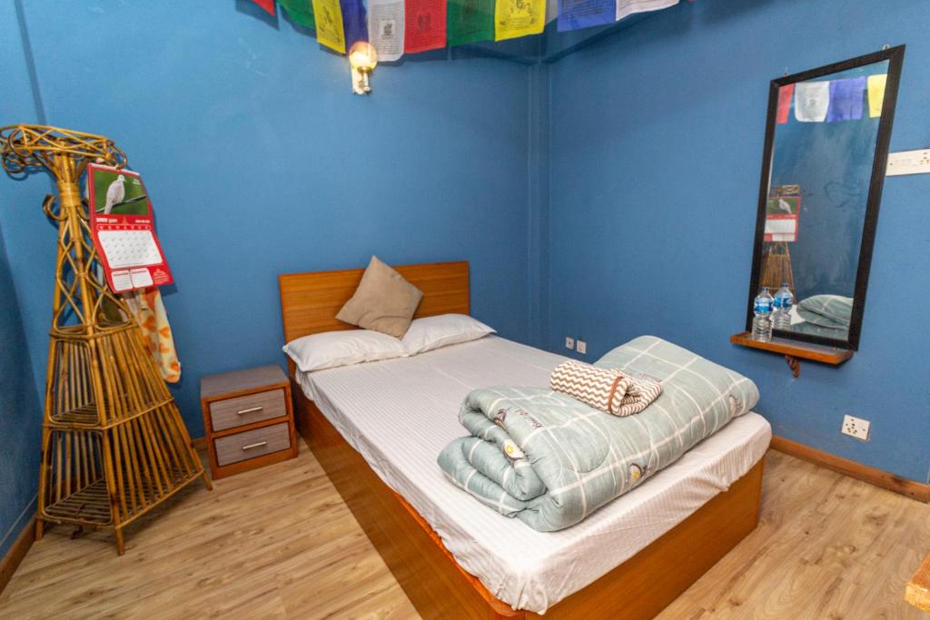 Voodi või voodid majutusasutuse Shekhar's Shared Home toas