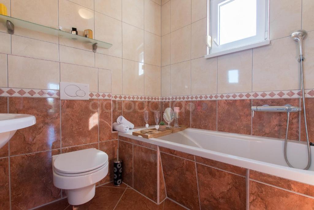Kúpeľňa v ubytovaní Seaview apartments Duky