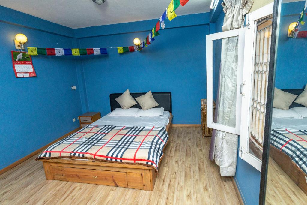 Voodi või voodid majutusasutuse Shekhar's Shared Home toas