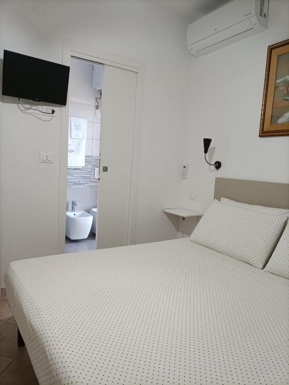 A bed or beds in a room at Il Respiro del Mare