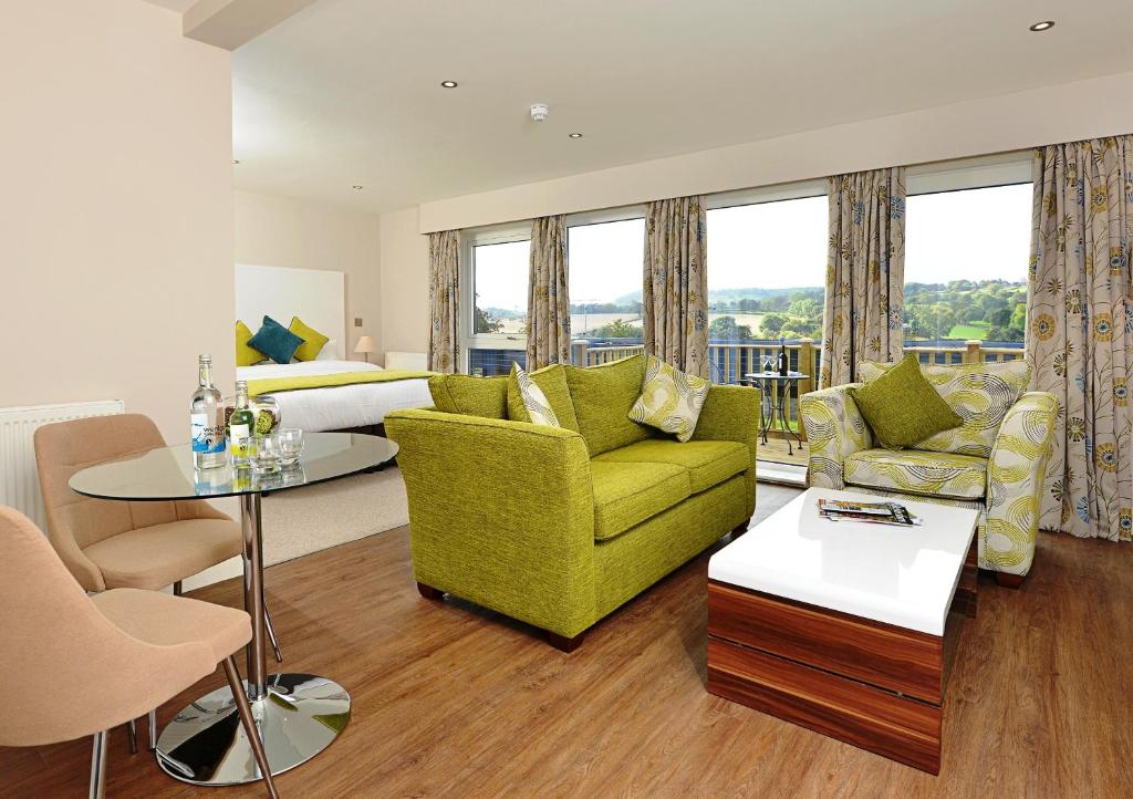 a living room with a couch and a table at The View at the White Horse Woolley Moor in Clay Cross