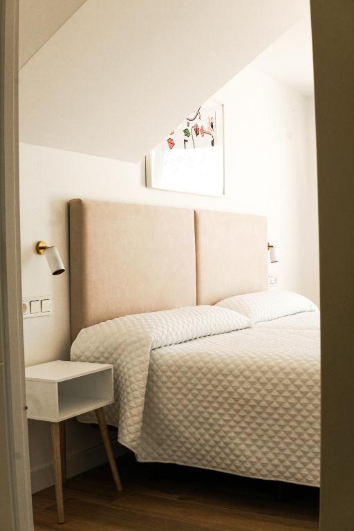 Кровать или кровати в номере Hostal Montevideo beachfront