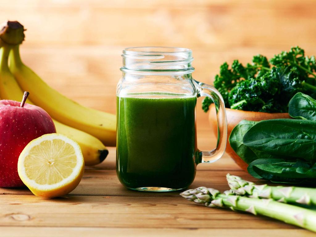 a jar of green juice next to some fruits and vegetables at Comfort Hotel Central International Airport in Tokoname