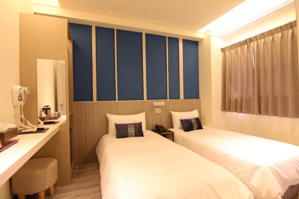 Postel nebo postele na pokoji v ubytování Prince Hotel