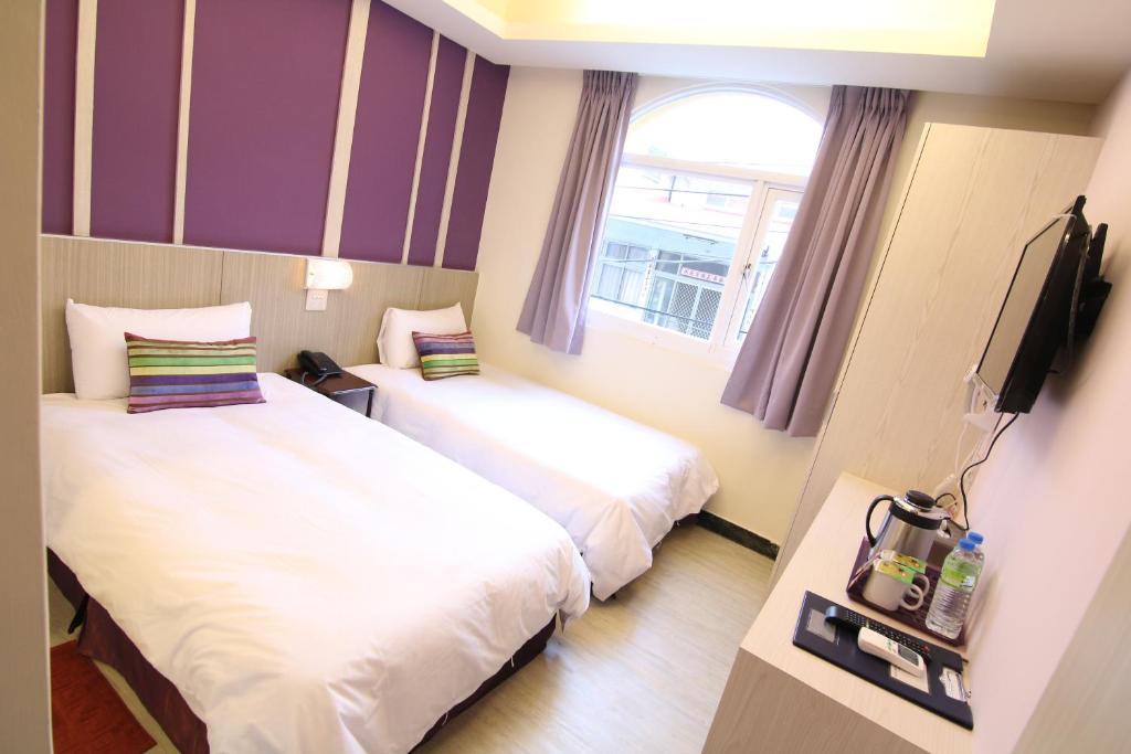 Postel nebo postele na pokoji v ubytování Prince Hotel