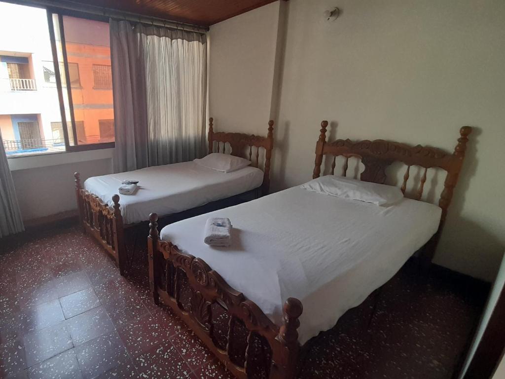 Postel nebo postele na pokoji v ubytování HOTEL en MONTERIA CITY