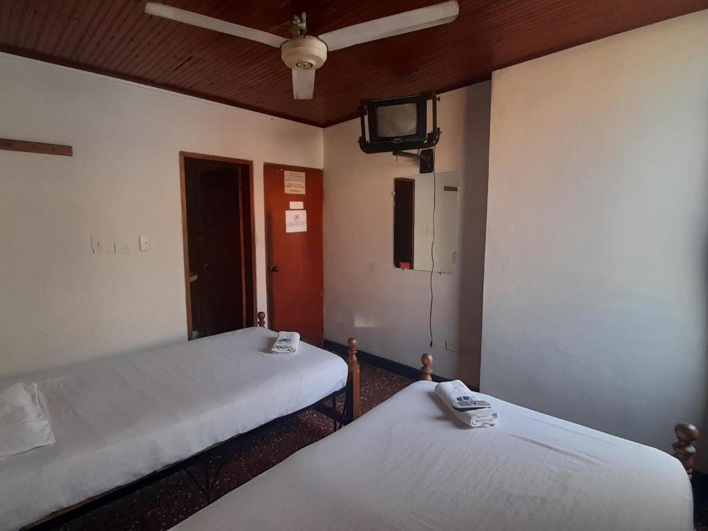 Postel nebo postele na pokoji v ubytování HOTEL en MONTERIA CITY