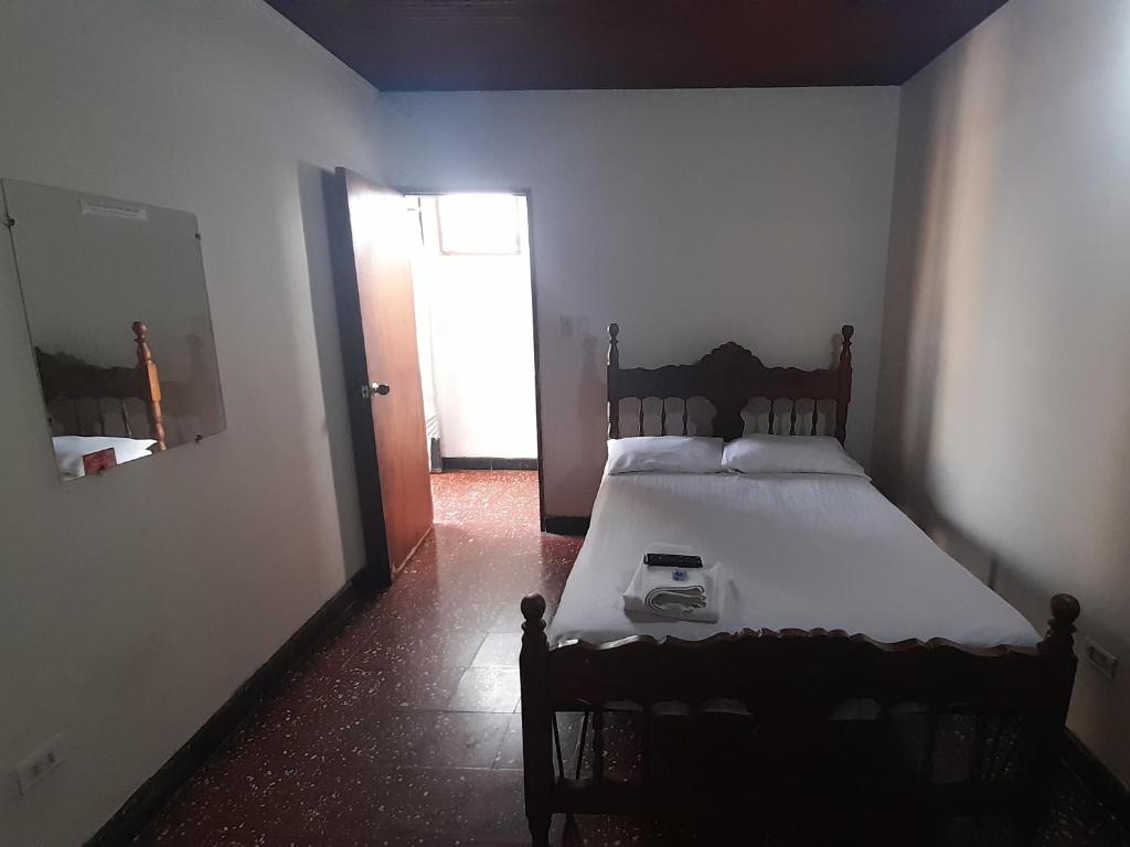 Postel nebo postele na pokoji v ubytování HOTEL en MONTERIA CITY