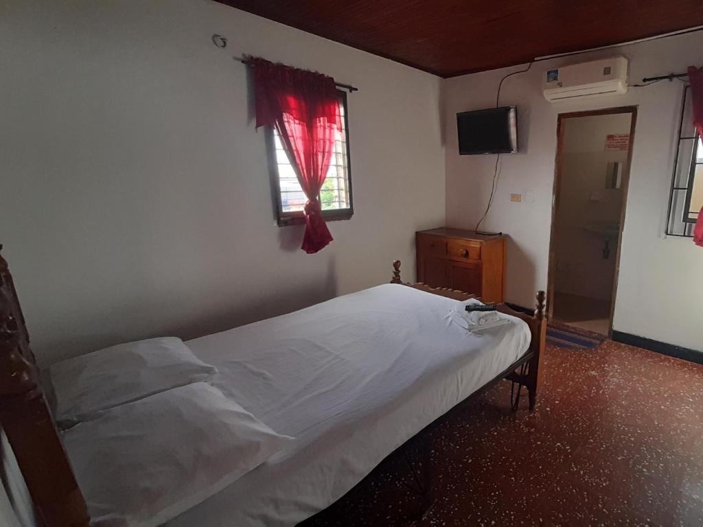 Postel nebo postele na pokoji v ubytování HOTEL en MONTERIA CITY