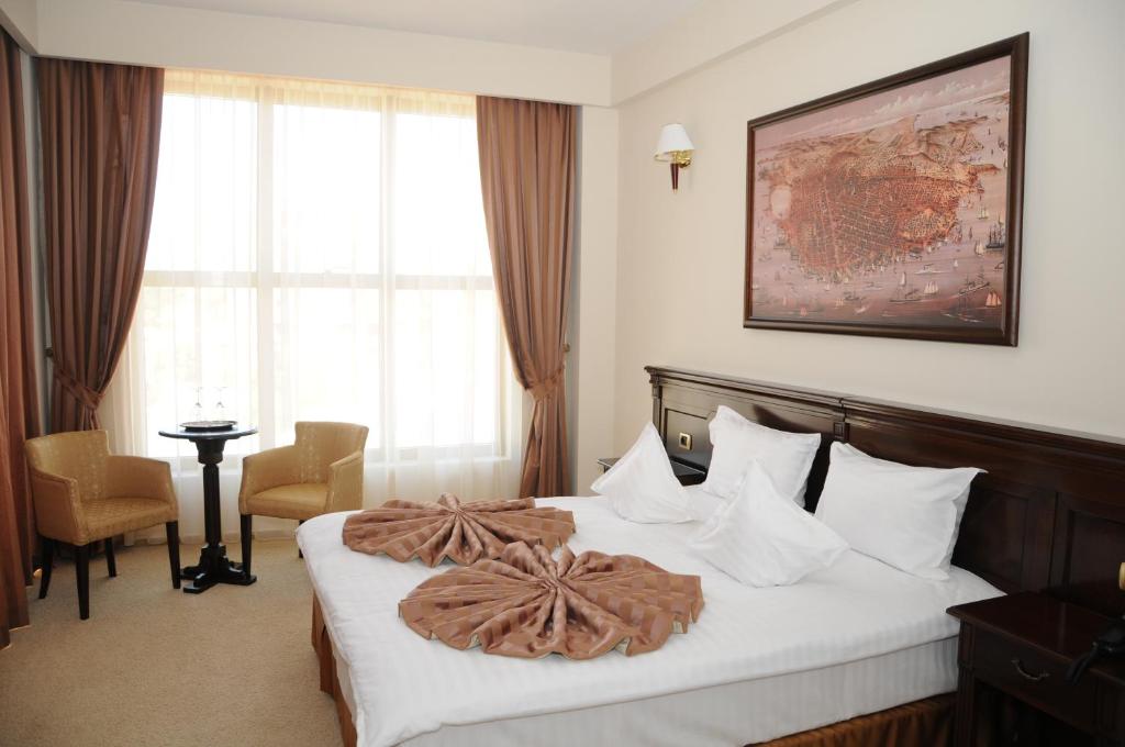 Postel nebo postele na pokoji v ubytování Hotel Rexton