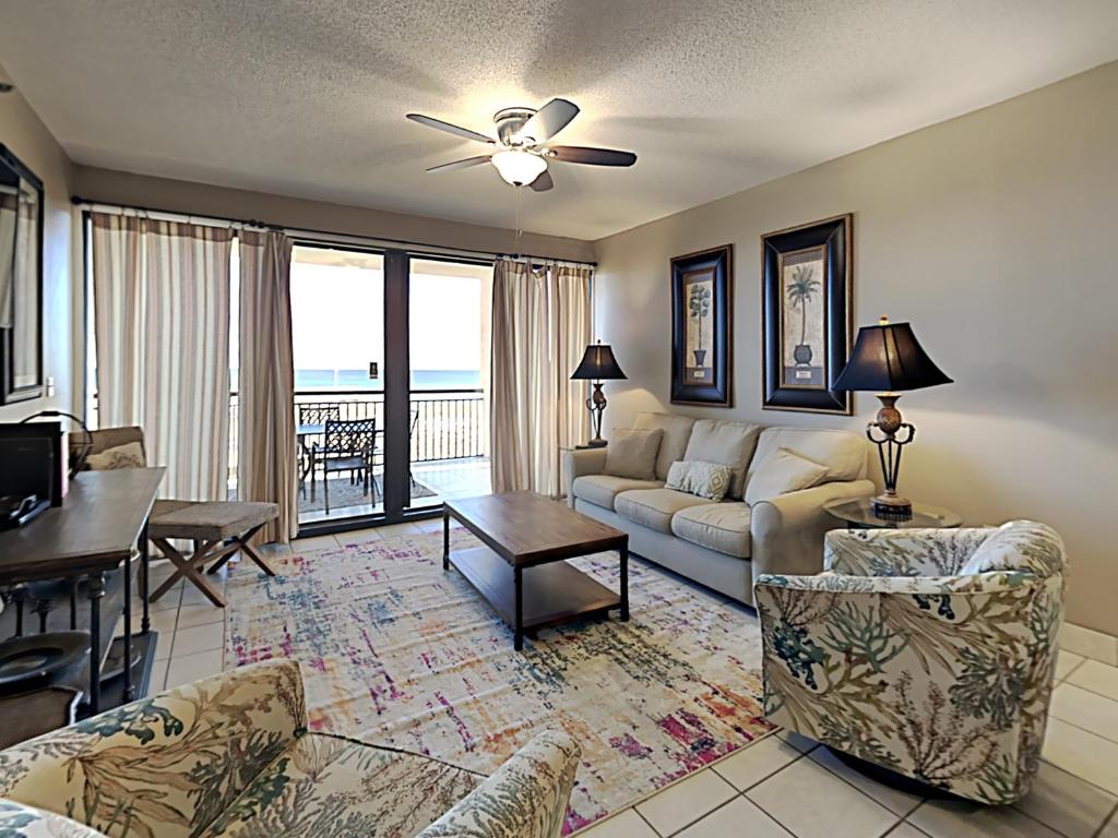 a living room with a couch and a table at Navarre Towers #203 in Navarre