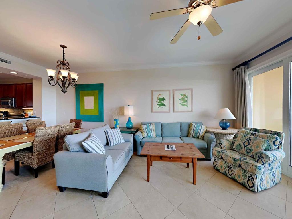 a living room with a couch and a table at Adagio 402D in Santa Rosa Beach