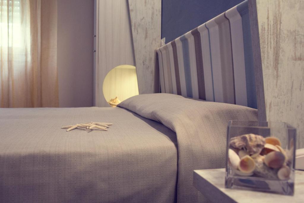 Postel nebo postele na pokoji v ubytování Hotel Trieste