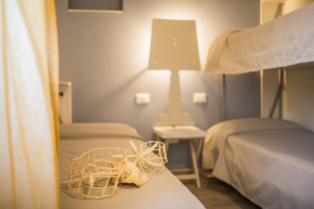 Postel nebo postele na pokoji v ubytování Hotel Trieste