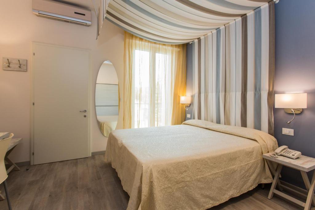 Postel nebo postele na pokoji v ubytování Hotel Trieste
