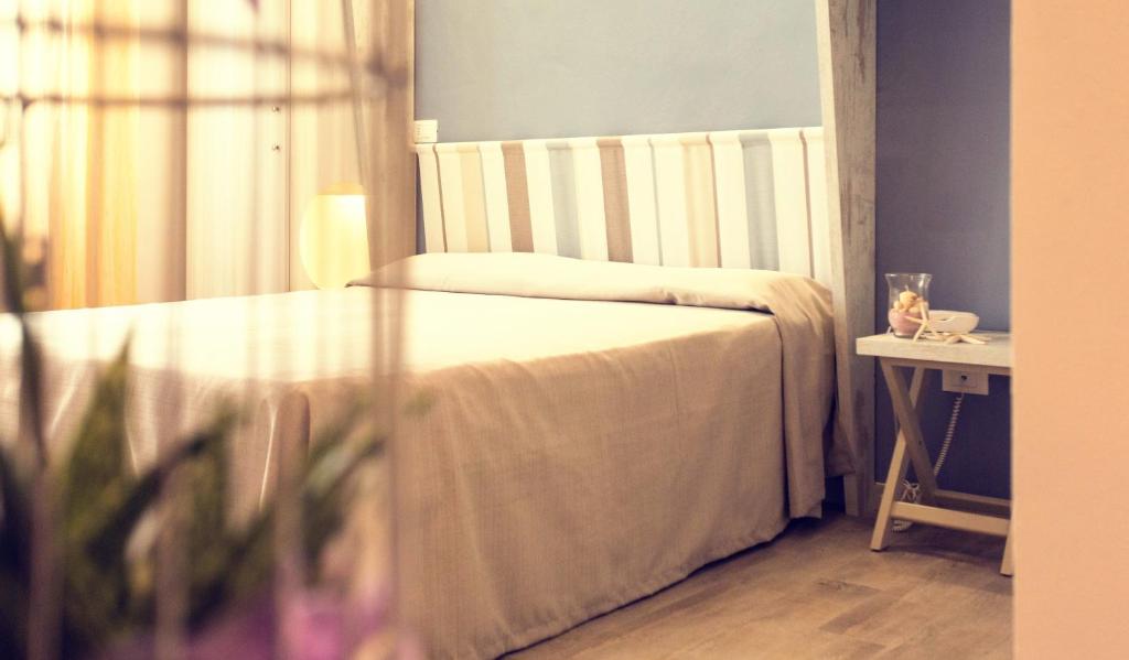 Postel nebo postele na pokoji v ubytování Hotel Trieste
