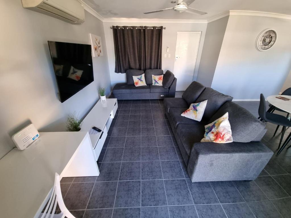 a living room filled with furniture and a couch at Ocean Beach Chalet 18 in Jurien Bay