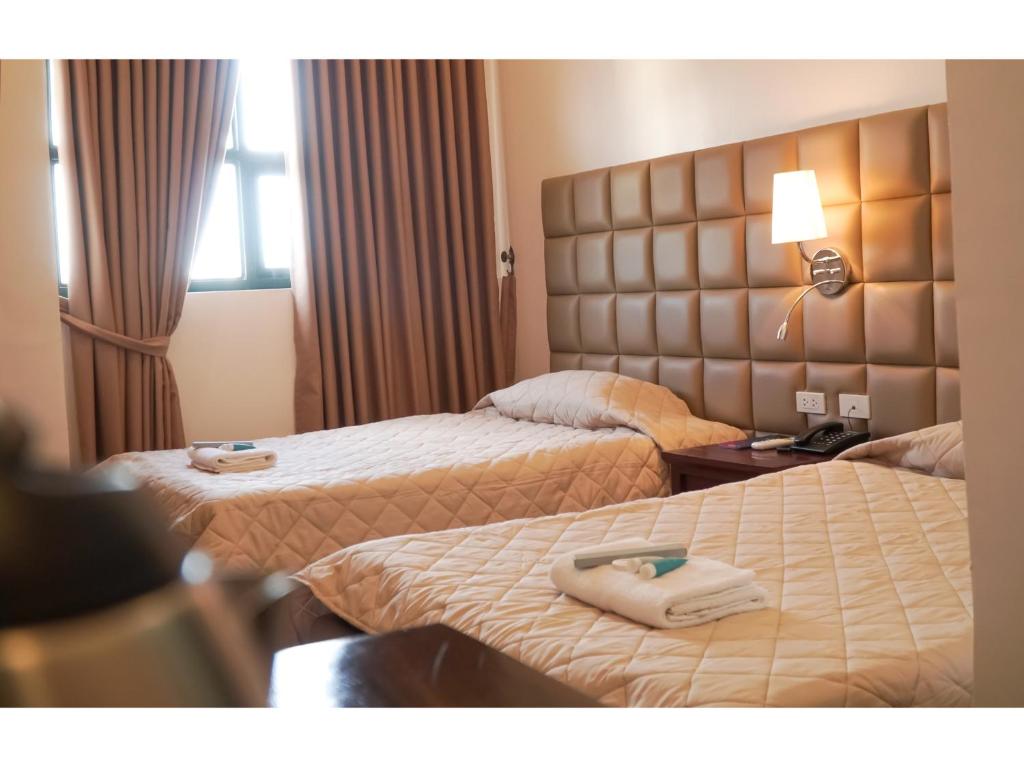 Postel nebo postele na pokoji v ubytování M28 Hotel and Apartments