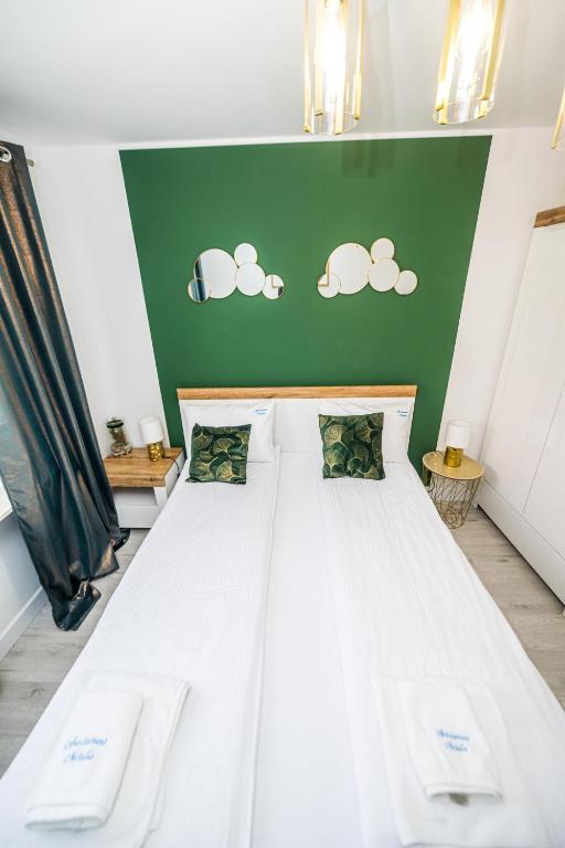 Posteľ alebo postele v izbe v ubytovaní Apartament Natalia