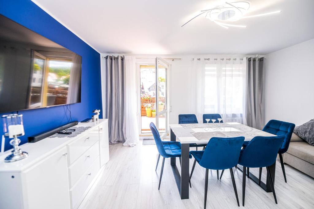 Televízia a/alebo spoločenská miestnosť v ubytovaní Apartament Natalia