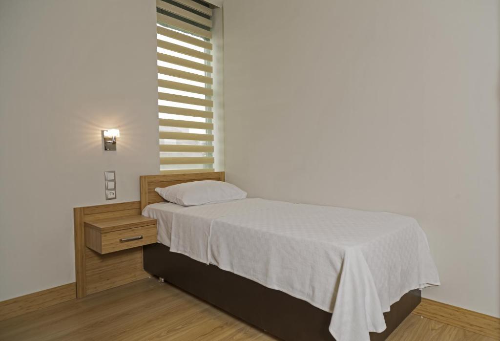 Postel nebo postele na pokoji v ubytování Demir Suite Hotel