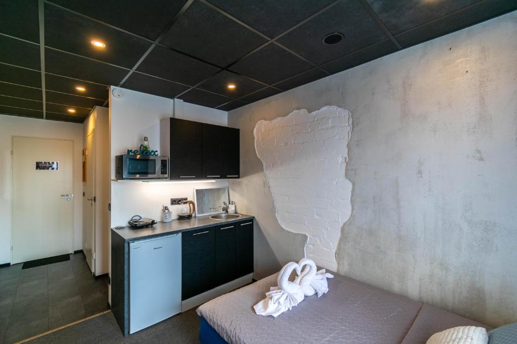 Kuchyň nebo kuchyňský kout v ubytování Apartments24 Ilu