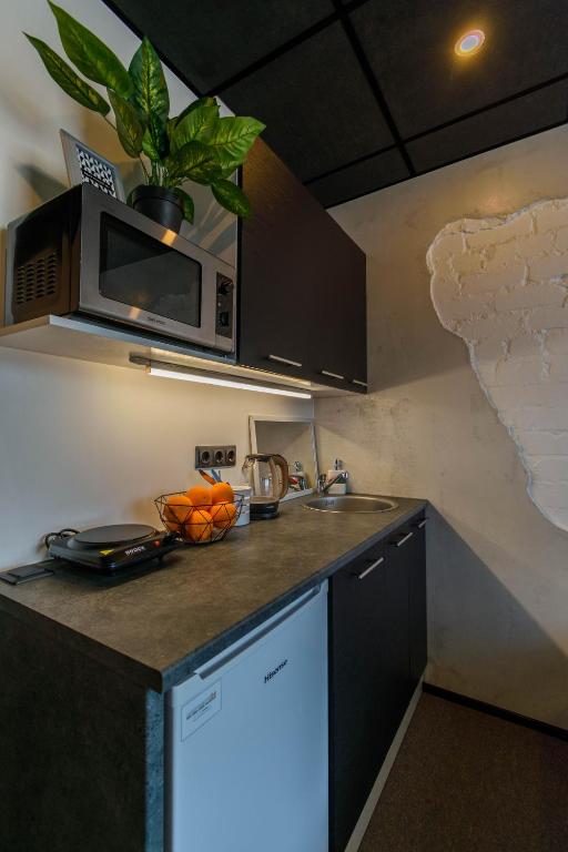 Kuchyň nebo kuchyňský kout v ubytování Apartments24 Ilu