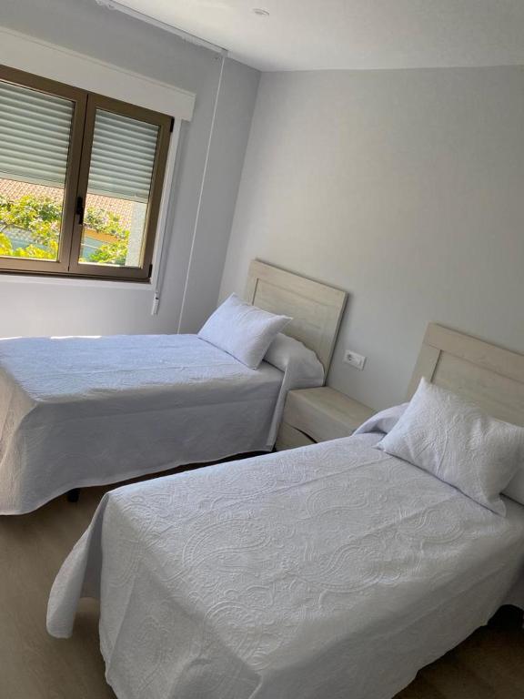 Posteľ alebo postele v izbe v ubytovaní Casa Surf Lanzada
