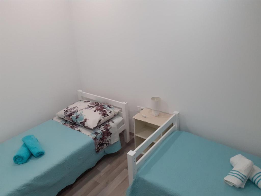 Łóżko lub łóżka w pokoju w obiekcie Apartmani Dream