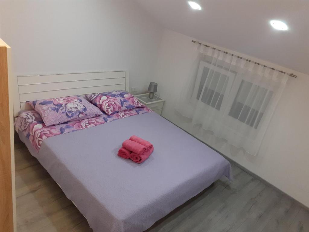 Łóżko lub łóżka w pokoju w obiekcie Apartmani Dream