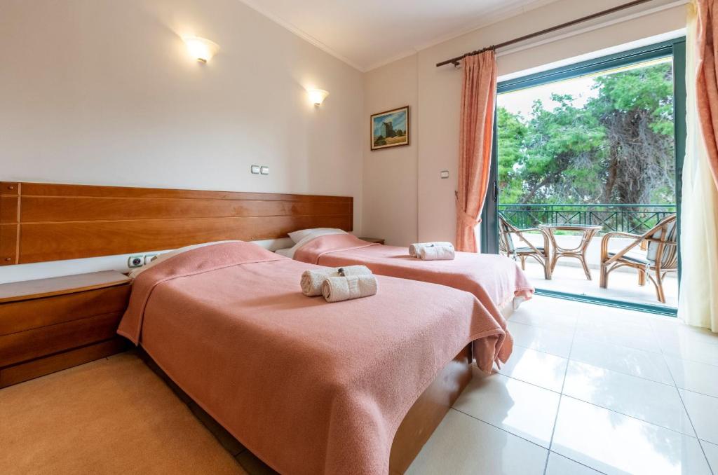 Postel nebo postele na pokoji v ubytování J Studios - Kineta Seaside Retreats