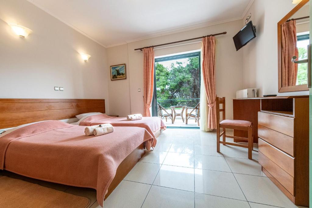 Postel nebo postele na pokoji v ubytování J Studios - Kineta Seaside Retreats