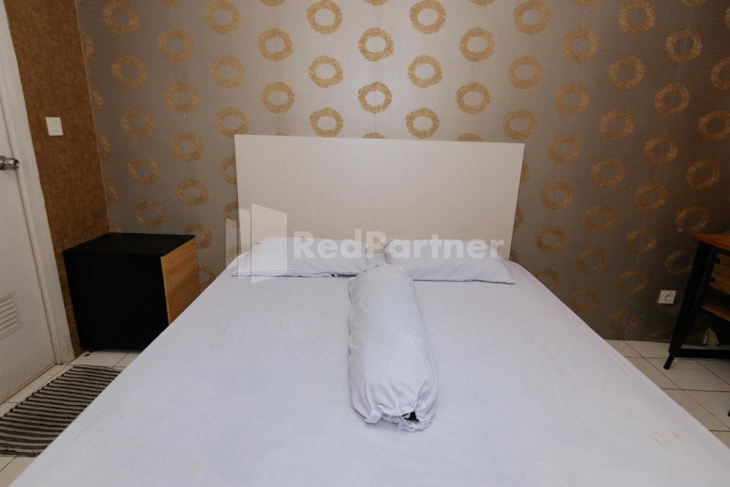 RedLiving Apartemen Podomoro Golf View - Queen Room Tower Dahomaにあるベッド
