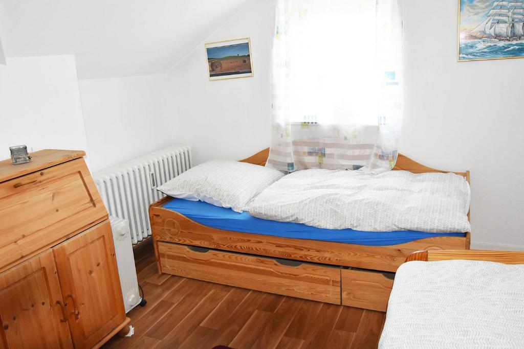 a small bedroom with a bed and a window at Apartment in Euskirchen in Euskirchen