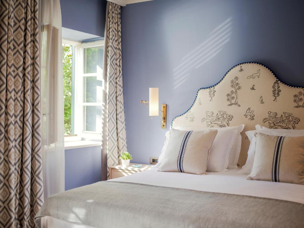Кровать или кровати в номере Hotel Supetar