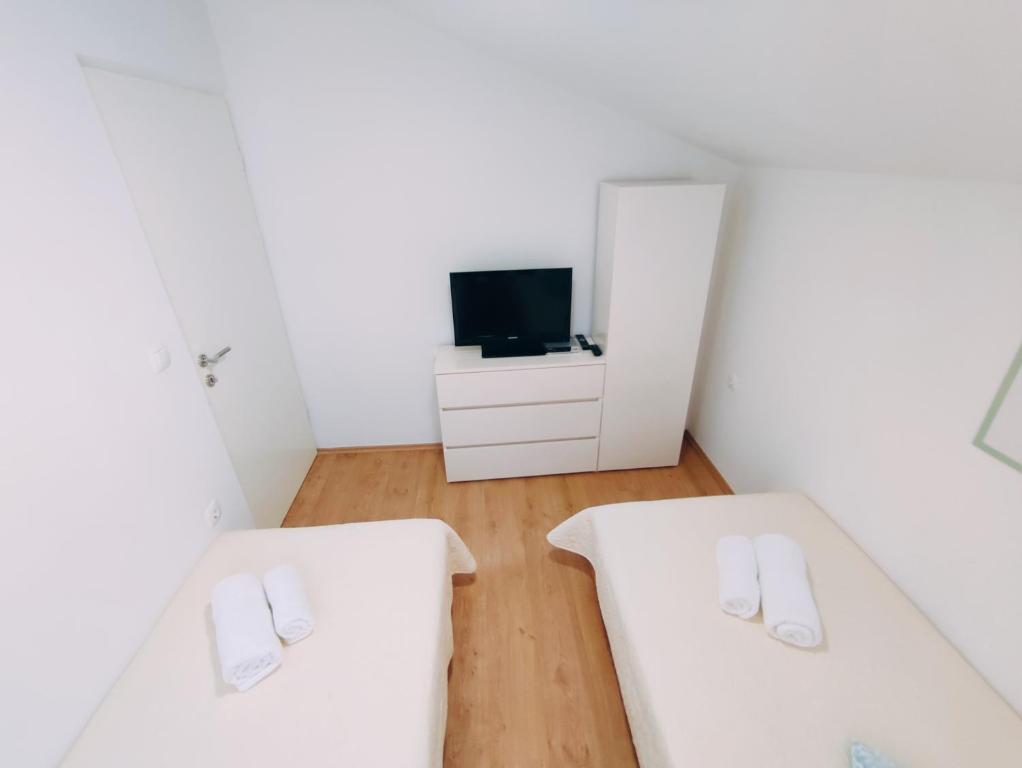 Łóżko lub łóżka w pokoju w obiekcie Apartment Prominac