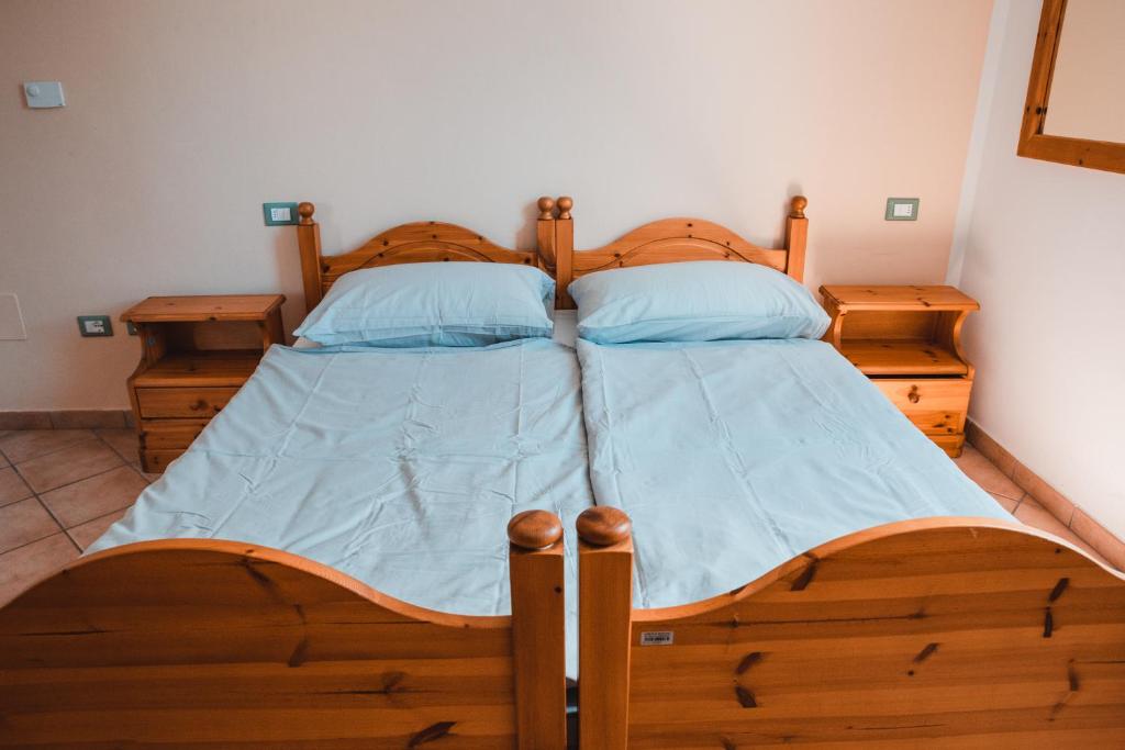 Postel nebo postele na pokoji v ubytování Casa del Parco Adamello