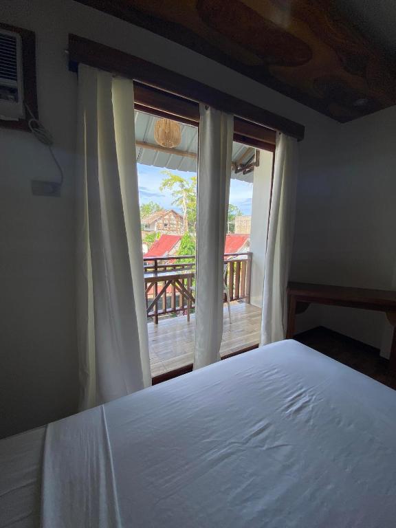 Voodi või voodid majutusasutuse Puyo Suites Homestay toas