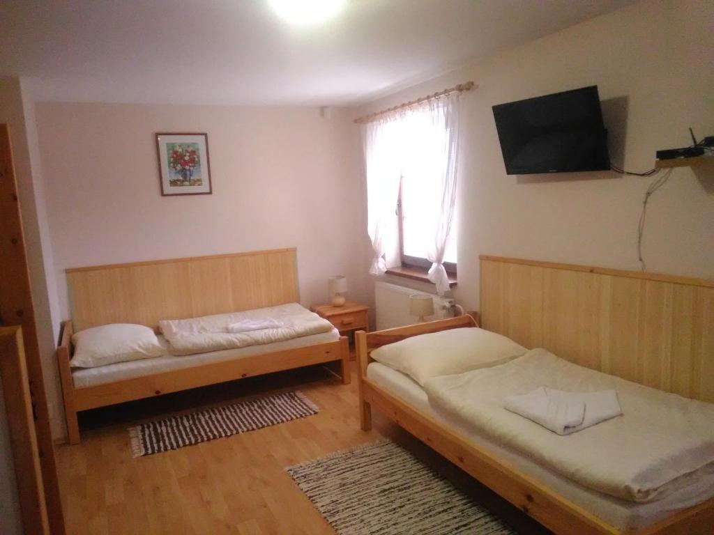 Postel nebo postele na pokoji v ubytování Pod palmou Gerlachov
