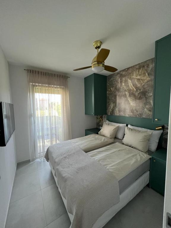 Posteľ alebo postele v izbe v ubytovaní CUBE Residence