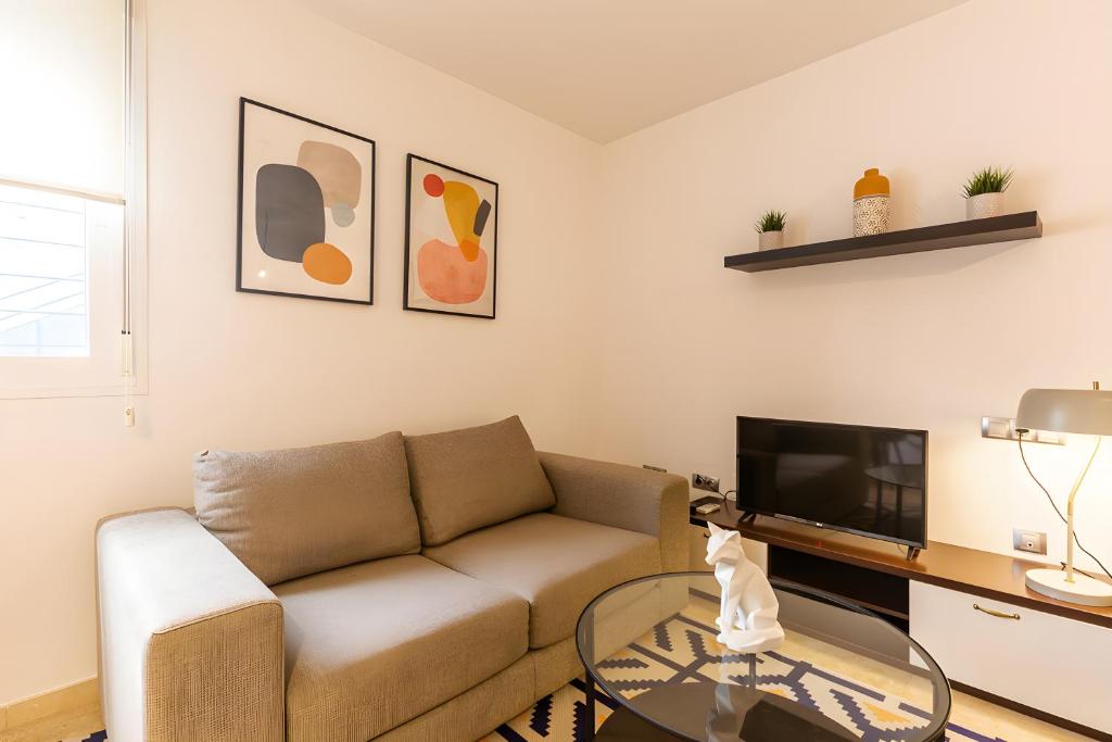 Televízia a/alebo spoločenská miestnosť v ubytovaní Teatro Suites Málaga CITY FLAT
